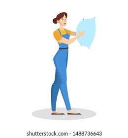 Woman in the uniform holding a pillow. Cleaning service concept. Cleaner doing domestic work. Isolated vector illustration in cartoon style