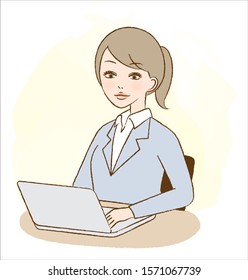 A woman uses a computer at work