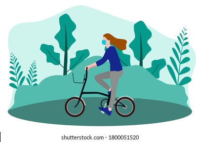 A woman uses a mask and rides a bicycle in the park