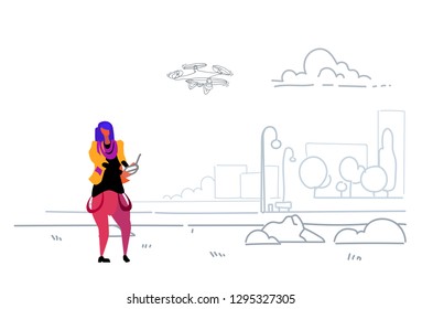 woman using aerial remote controller playing drone copter modern city urban park