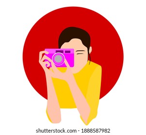 A woman using a camera.