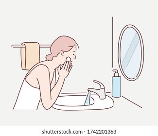 Woman Using Cosmetic Cleansing Gel Or Facial Wash To Clean Her Face. Hand Drawn Style Vector Design Illustrations.