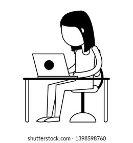 woman using laptop in black and white