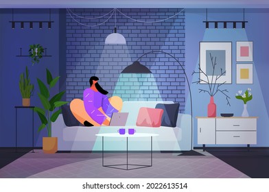 woman using laptop in dark night living room social media network online communication concept horizontal