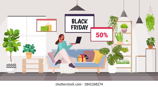 woman using laptop online shopping black friday big sale holiday discounts concept living room interior full length horizontal vector illustration