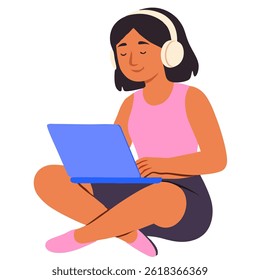 a woman using a laptop and sitting on the floor