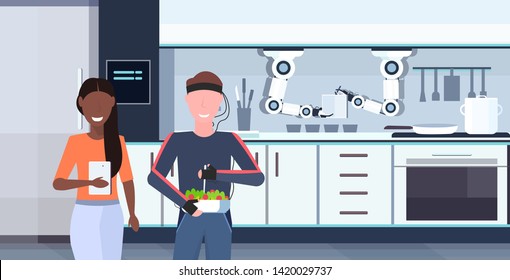 woman using mobile app controlling man humanoid with wires electrodes indicators smart handy chef robot preparing food robotic assistant concept modern kitchen interior flat horizontal portrait