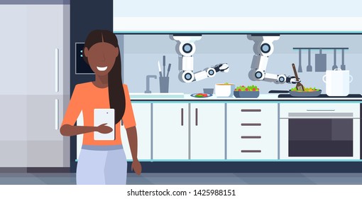 woman using mobile app controlling smart handy chef robot preparing fried eggs and omelet robotic assistant innovation artificial intelligence concept modern kitchen interior horizontal portrait
