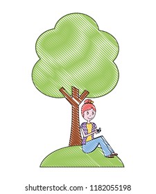 woman using phone sitting in under a tree