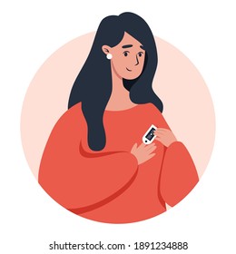 Woman using pulse oximeter device on finger