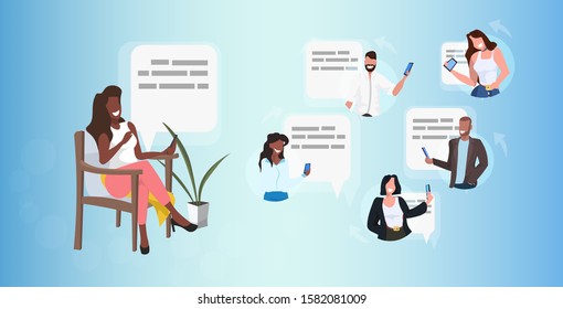 woman using smartphone chatting with mix race friends social network speech chat bubble communication concept african american girl sitting on armchair full length horizontal vector illustration