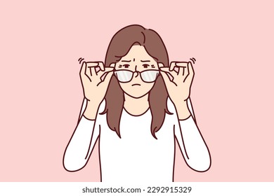 Woman with vision problems squint when touching does not help them see fine print at distance. Young girl loses vision and needs help of ophthalmologist or vitamin with beneficial substances for eyes