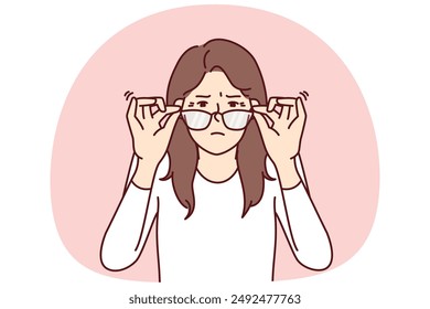 Woman with vision problems squint when touching does not help them see fine print at distance. Young girl loses vision and needs help of ophthalmologist or vitamin with beneficial substances for eyes