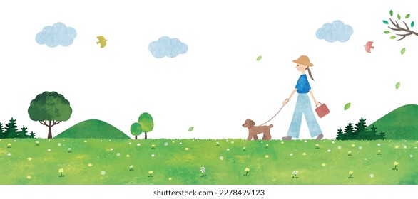 Woman walking with dog in grasslands
