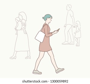 A woman is walking down the street watching a cell phone. hand drawn style vector design illustrations.