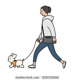A woman walking her dog. Chihuahua and a woman.