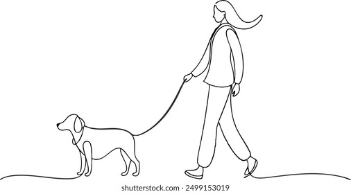 A woman is walking her dog on a leash. The dog is a small breed and he is well-behaved