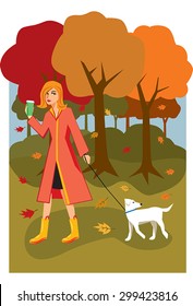 Woman walking on a fall day with a small dog