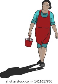 The woman is walking with a shadow a hand full of bucket of ice wearing a red apron.