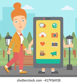 Woman walking with smartphone.