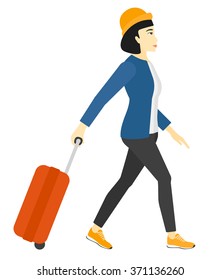 Woman walking with suitcase.