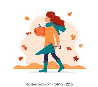 Woman walking with umbrella and pumpkin autumn. Vector illustration in flat style