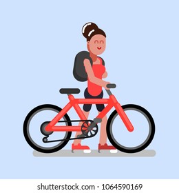 Woman walks with bike