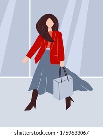 A woman walks with a shopping bag through a shopping center. Shopping, fashion and style. Red jacket.