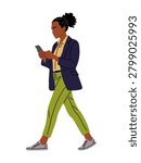 Woman walks while using her phone. She wears a blazer and vibrant pants. Her hair is styled in a neat bun. She moves confidently through her day. Perfect for urban lifestyle or tech themes