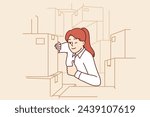 Woman warehouse supervisor shows thumbs up as sign of completion of audit and absence of lost goods. Girl working in logistics warehouse winks eye, urging to use fulfillment services.