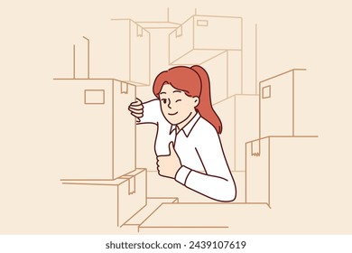 Woman warehouse supervisor shows thumbs up as sign of completion of audit and absence of lost goods. Girl working in logistics warehouse winks eye, urging to use fulfillment services.