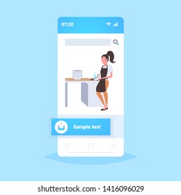 woman washing dishes housewife wiping plates on kitchen dishwashing concept girl in apron doing housework smartphone screen mobile app flat full length