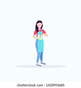 woman washing dishes housewife wiping plates with towel on kitchen dishwashing concept girl in apron doing housework flat full length