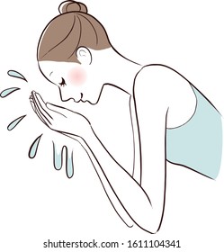 A woman washing her face