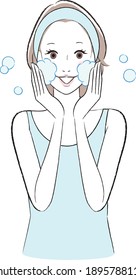 A woman washing her face with fluffy foam.