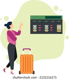 Woman watching departure digital board in airport