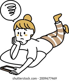  A woman watching a video while lying down (disappointed)
