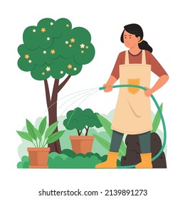 Woman Watering Plants in Garden.