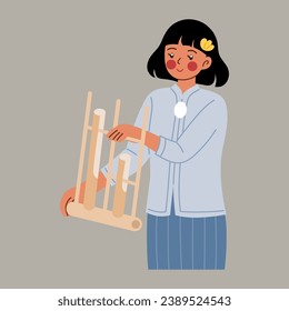 Woman wear kebaya playing angklung instrument