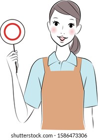 Woman wearing an apron holding the correct sign