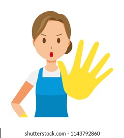 A woman wearing a blue apron and rubber gloves is stop gesture