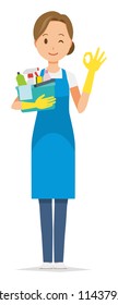 A woman wearing a blue apron and rubber glove is playing an okay sign, holding some cleaning tools