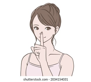 A woman wearing a camisole with her index finger on her mouth