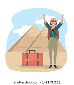 woman wearing hat with backpack and egyptian pyramid
