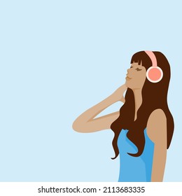 woman wearing headphones listening to music with blue background