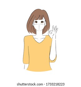 A woman wearing a mask and making a finger