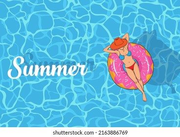 woman wearing red swimsuit The red hat lies on a pink donut ring. top view swimming pool