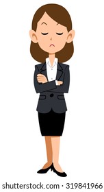 woman wearing a suit with her arms folded