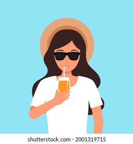 Woman wearing sunglasses and hat drinking fruit juice in summer vacation. Drink fruit cocktail at the beach.