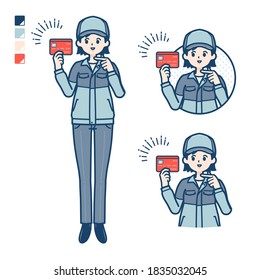 A woman wearing workwear with pointing at credit card images.
It's vector art so it's easy to edit.
